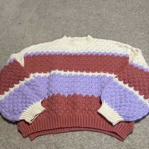 multicolored sweater, barley worn